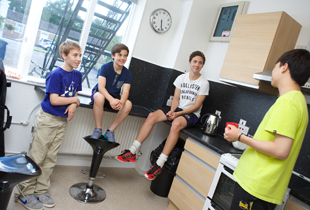 Boarders relaxing in the kitchen at Kimbolton House, Kimbolton School